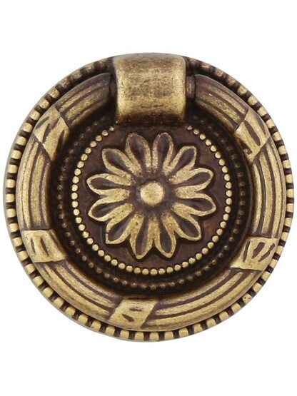 Ribbon and Reed Single-Post Pull with Flower Motif - 1.5 inch Diameter in Antique Brass Dark.